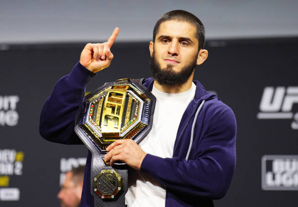 Islam Makhachev holding UFC belt